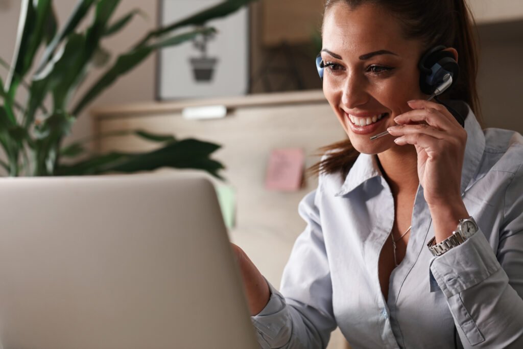 Lending Massachusetts - happy customer service representative talking with customer while using laptop office Scottsdale Mortgage Loans | Best Mortgage Specialist